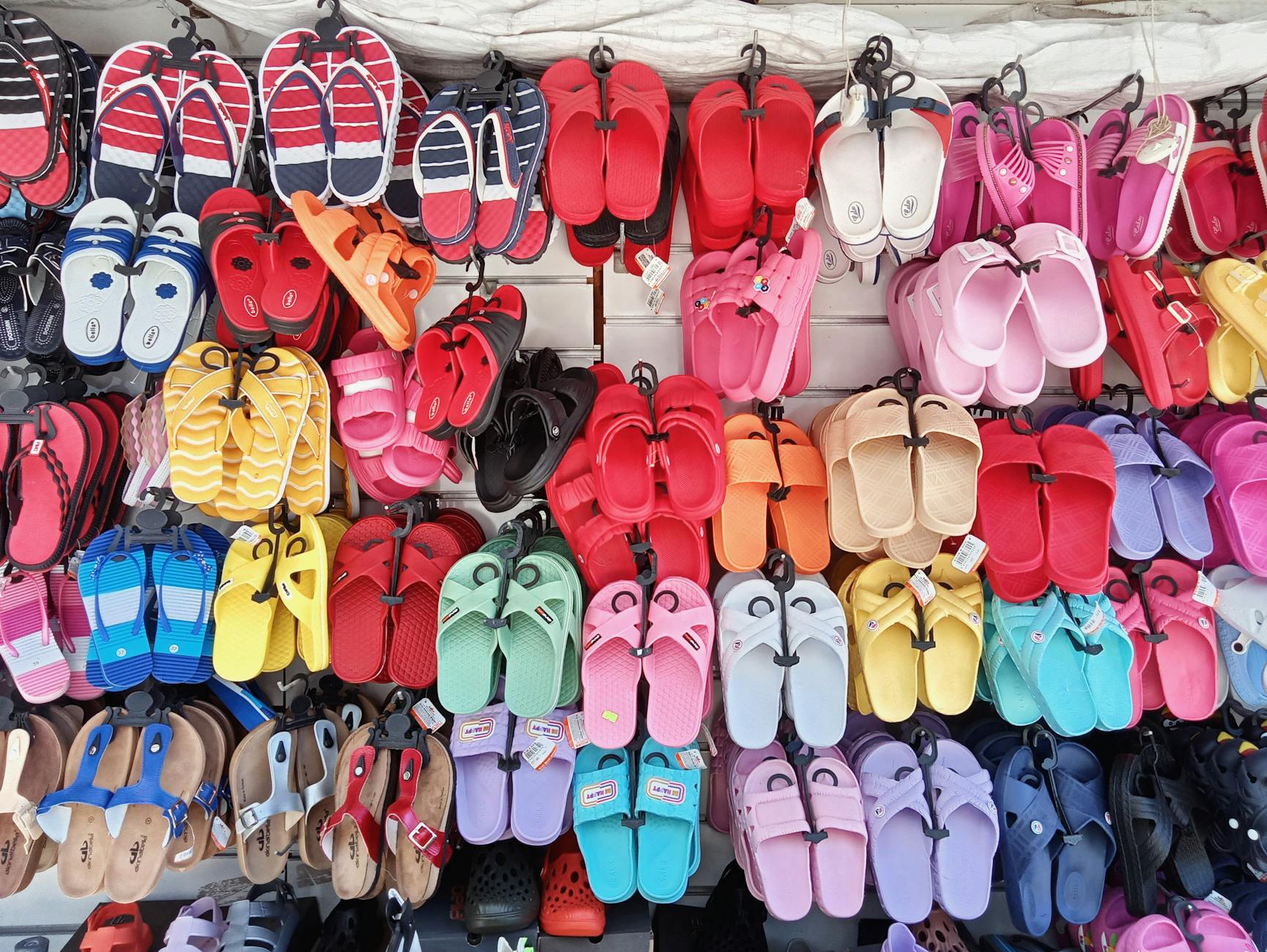 Colorful sandals at a market — the $23 billion flip-flop industry
