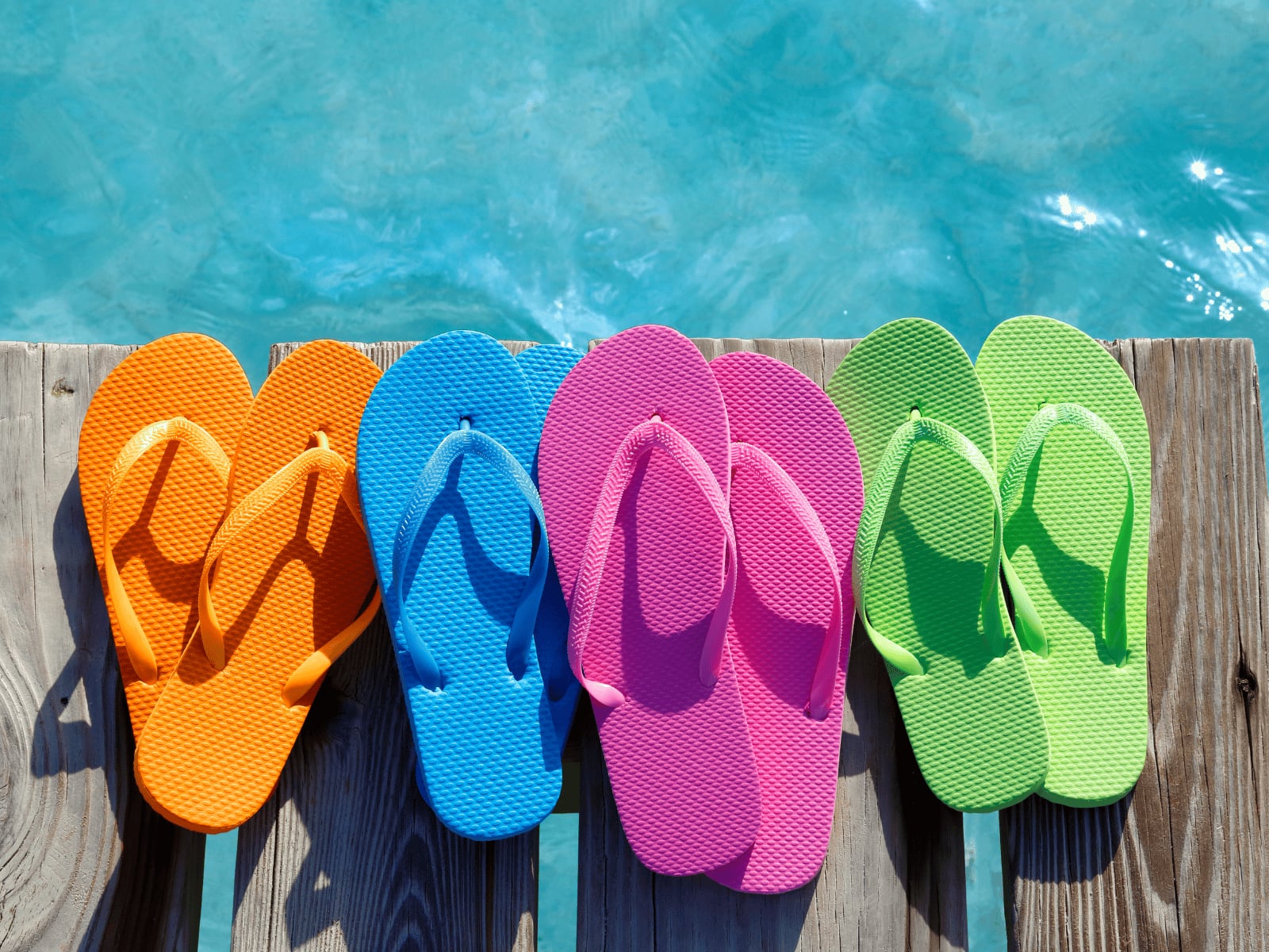 Colorful flip flops poolside